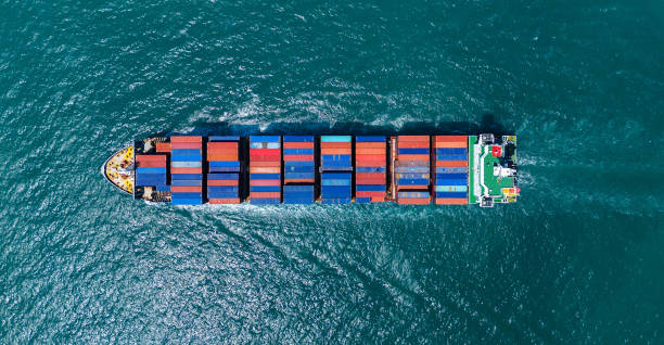 istock Cargo container ship carrying container and running out from international container port customs shipyard sea port concept smart logistic service. Container Ship freight export 2175866316