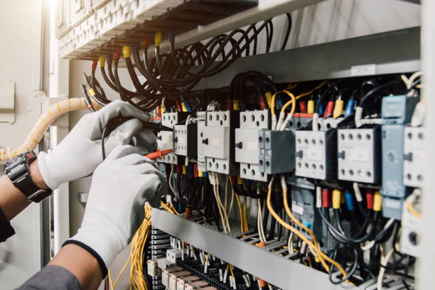 istock Electrician engineer tests electrical installations and wires on relay protection system. 2175868193