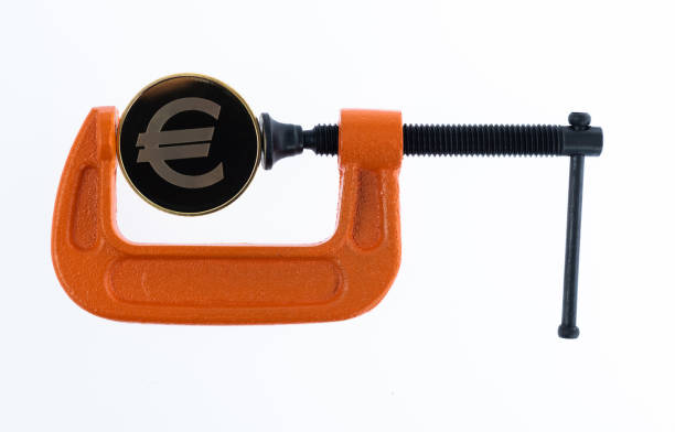Orange clamp with a euro coin.