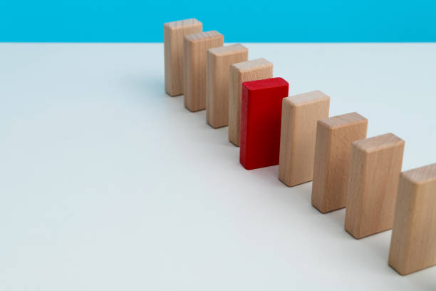 istock The red domino stands out 2175870588