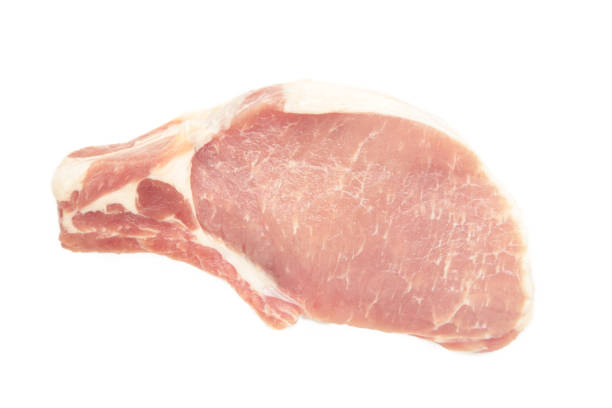 Sliced raw pork meat isolated on white background. Top view.