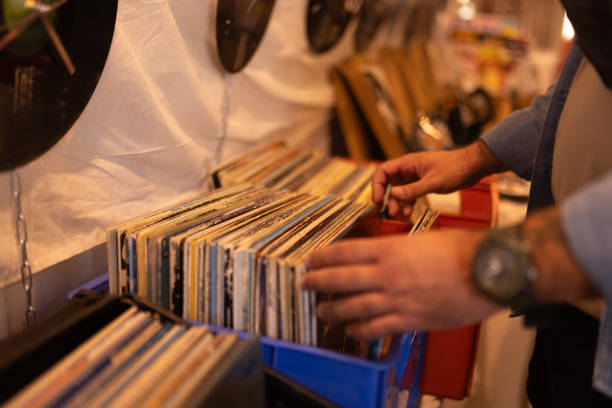 istock Man hands browsing vinyl album in a record store 2175879659