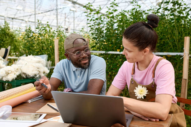 istock Smiling Black Man Discussing Project with Colleague at Plantation 2175880064