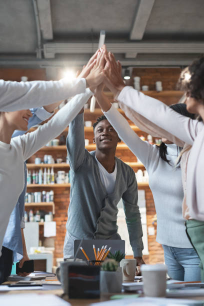 istock Black manager giving high five to his international young team 2175880527