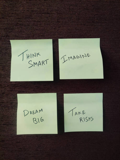 istock Sticky notes featuring motivational words such as 'Think Smart,' 'Imagine,' 'Dream Big,' and 'Take Risks,' encouraging innovation, ambition, and strategic thinking. 2175887223