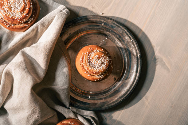 istock Delicious homemade cinnamon buns on a rustic plate 2175890753