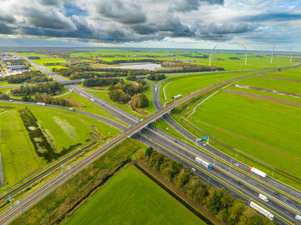 istock Traffic at a highway junction in with clouds in the background 2175892650