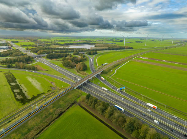 istock Traffic at a highway junction in with clouds in the background 2175892705