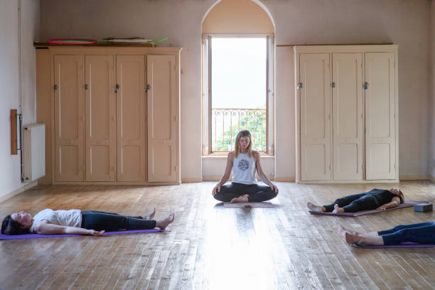istock Four people in a quiet session after a yoga class 2175896240