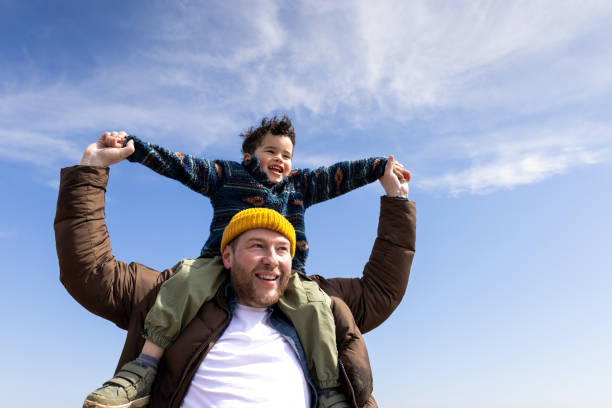 istock Child on Dad’s Shoulders Enjoying the View 2175897211