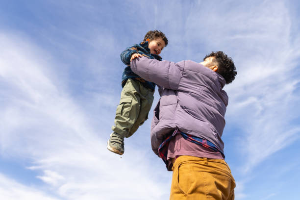 istock Father Lifting His Son in the Air with Joy 2175897227