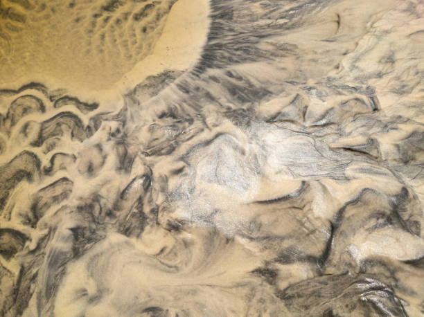 istock Golden beige wet sand texture. Natural background 2175898181