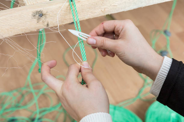 istock Fishermen knitting their net ,Close up 2175903248