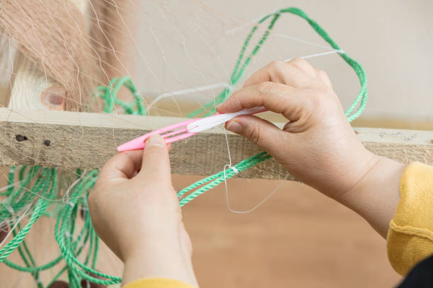 istock Fishermen knitting their net ,Close up 2175903584