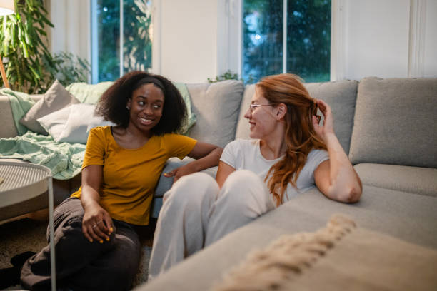 istock Two friends chatting and smiling together. 2175903704