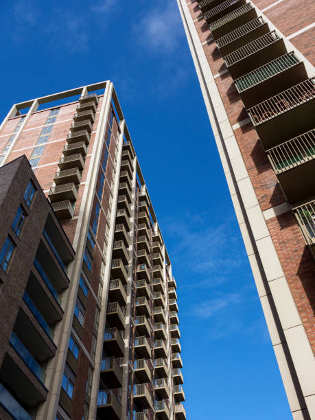 istock Tall residential buildings with balconies under a clear blue sky. 2175913266