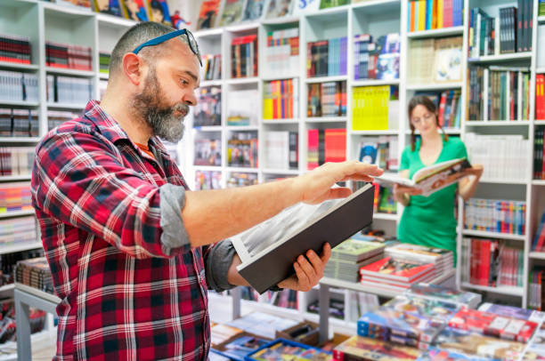 istock Nerdy person chooses a comic book to buy 2175920360
