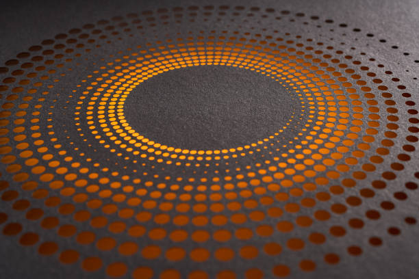 istock Intricate circular design of orange gradient dots cut into black paper creating a striking visual effect 2175920640