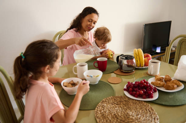 istock Family enjoying breakfast together at home dining table 2175927473