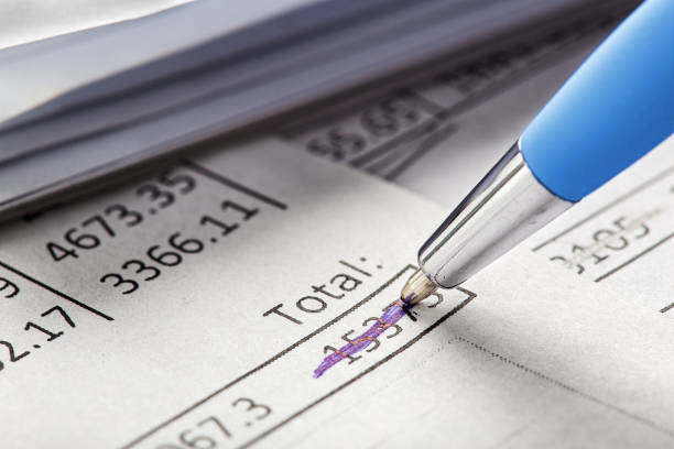 Checking the value of securities. Pencil, share listing and checking financial chart. Concept of banking, financial report and financial audit.