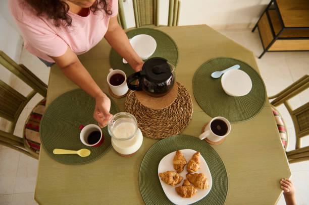 A cozy breakfast setting with coffee and croissants