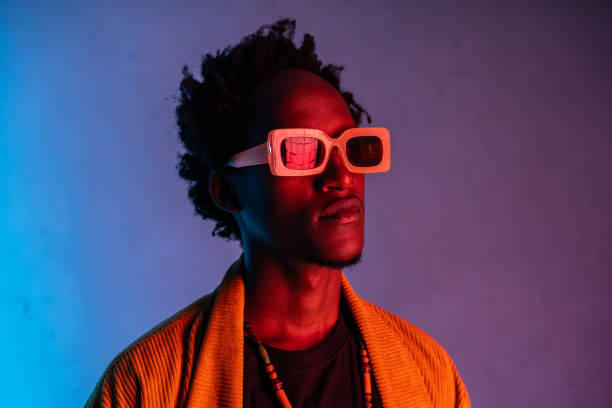 istock Headshot of man lit by neon lighting 2175948134