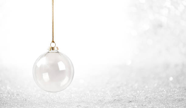 istock Glass Christmas Bauble against a Sparkling White Background 2175950238