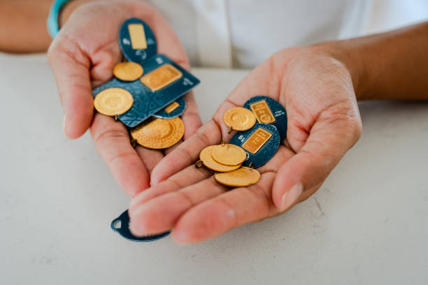 istock Businesswoman holding golds for saving 2175952043