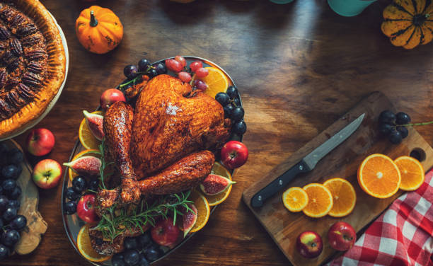 istock Preparing stuffed turkey with side dishes for Thanksgiving holiday 2175953161