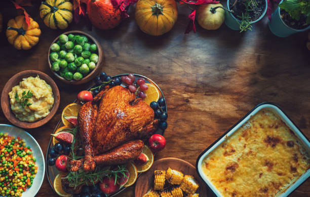 istock Preparing stuffed turkey with side dishes for Thanksgiving holiday 2175953198