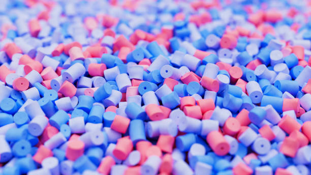 istock Closeup of colorful pastel mix plastic polypropylene granules, masterbatch polymer grain with shallow dof. HDPE or PVC resin pellets. 3d render illustration 2175953647