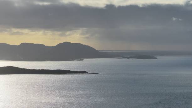istock Serene seascape with distant mountains at sunset 2175964817