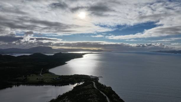 istock Scenic coastal landscape with sun shining through clouds. 2175964868
