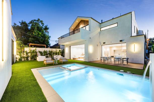 istock Luxury home with swimming pool at dusk 2175965724