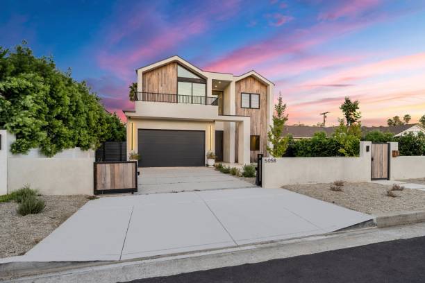 istock Contemporary house with driveway and sunset sky 2175965759