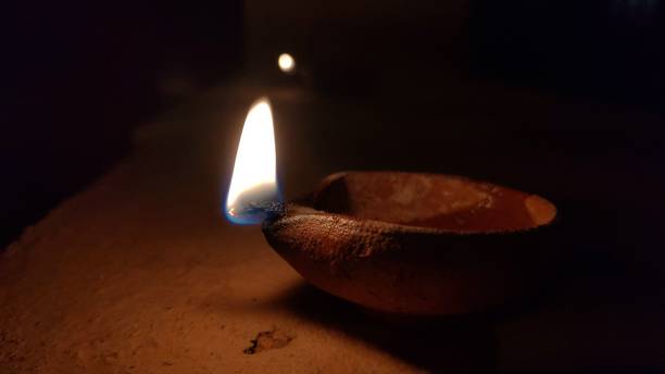 istock Traditional clay oil lamp with a bright flame 2175965898