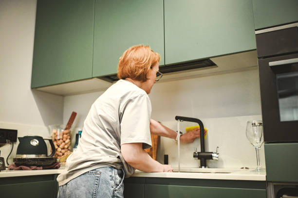 istock housewife cleaning the kitchen 2175966042