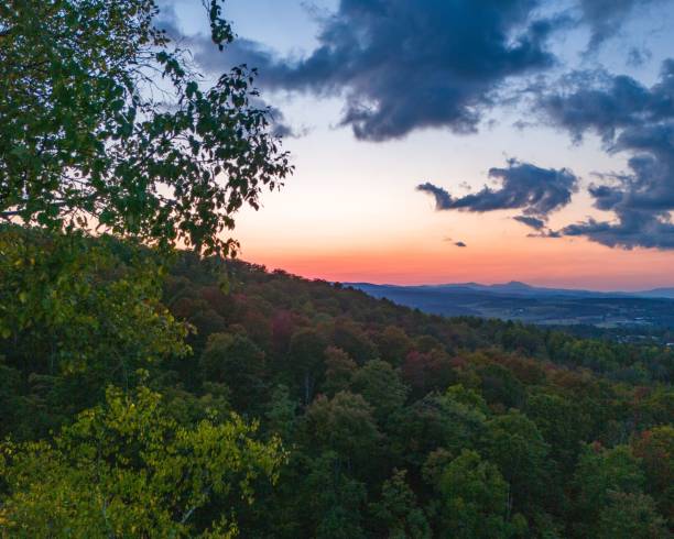 istock Forested mountainside at sunset with colorful sky. 2175967626