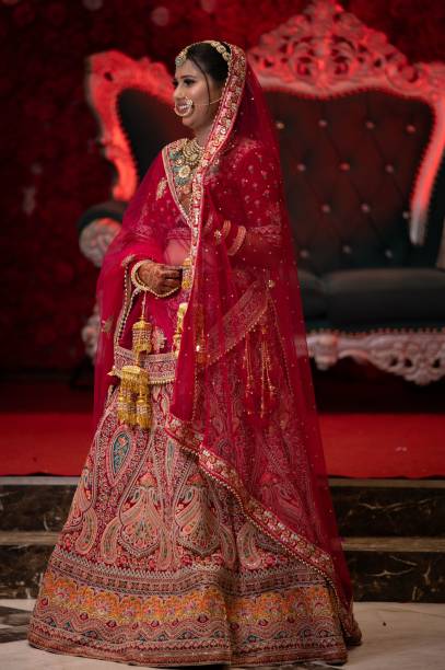 istock A bride in traditional Indian attire posing during a wedding ceremony 2175967728