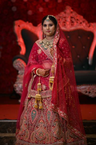 istock An Indian bride in traditional red bridal attire 2175967732
