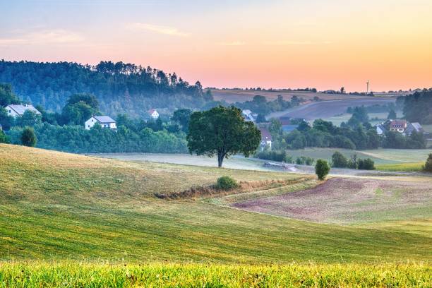 istock Rural landscape with rolling hills and sunset 2175967968