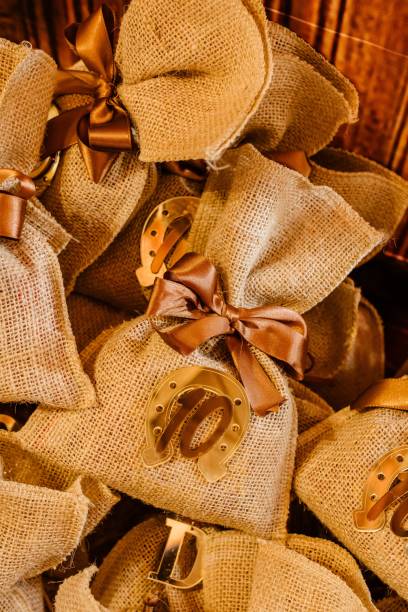 istock Burlap gift bags with bronze horseshoe embellishments 2175968434