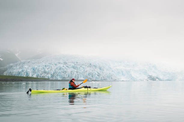 istock Woman Kayaking by a Glacier in Alaska 2175968838