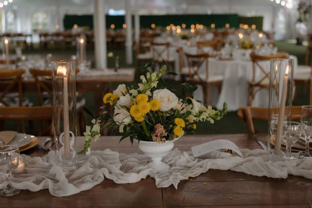 istock Elegant wedding reception table setup with floral centerpiece and candles. 2175969339