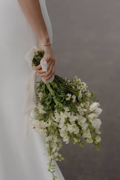 istock Bride holding a bouquet of white flowers. 2175969382