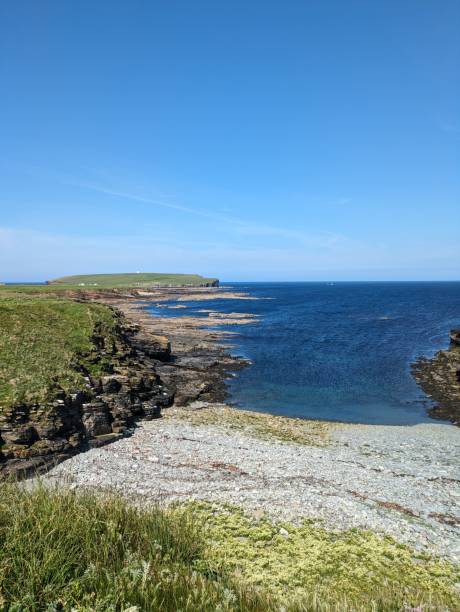 istock Rocky coastline with clear blue water and bright sky 2175970890