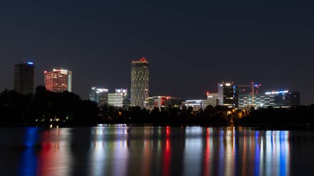 istock City skyline at night with reflections 2175971646
