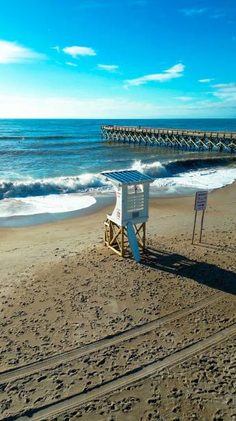 istock Sunny Beach with Lifeguard Tower and Pier 2175971836