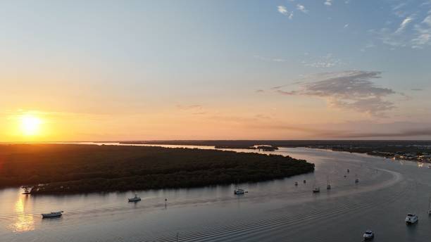 istock River landscape at sunset with anchored boats. 2175971904