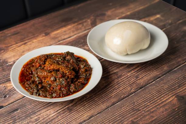 istock African vegetable soup with assorted meat and pounded yam. 2175971940